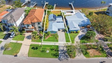 Discover unparalleled waterfront living with expansive views of on Mangrove Bay Golf Course in Florida - for sale on GolfHomes.com, golf home, golf lot