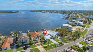 Discover unparalleled waterfront living with expansive views of on Mangrove Bay Golf Course in Florida - for sale on GolfHomes.com, golf home, golf lot