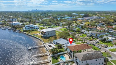 Discover unparalleled waterfront living with expansive views of on Mangrove Bay Golf Course in Florida - for sale on GolfHomes.com, golf home, golf lot