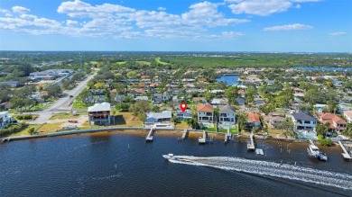 Discover unparalleled waterfront living with expansive views of on Mangrove Bay Golf Course in Florida - for sale on GolfHomes.com, golf home, golf lot