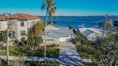 Discover unparalleled waterfront living with expansive views of on Mangrove Bay Golf Course in Florida - for sale on GolfHomes.com, golf home, golf lot