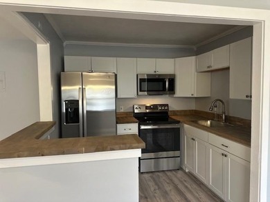 Renovated Waterfront Villa! Freshly painted, vinyl wood flooring on Kings Point Golf -Flanders Way in Florida - for sale on GolfHomes.com, golf home, golf lot