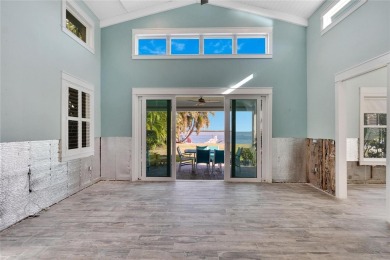 Discover unparalleled waterfront living with expansive views of on Mangrove Bay Golf Course in Florida - for sale on GolfHomes.com, golf home, golf lot