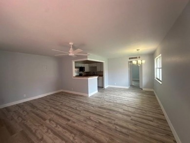 Renovated Waterfront Villa! Freshly painted, vinyl wood flooring on Kings Point Golf -Flanders Way in Florida - for sale on GolfHomes.com, golf home, golf lot