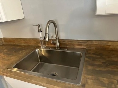 Renovated Waterfront Villa! Freshly painted, vinyl wood flooring on Kings Point Golf -Flanders Way in Florida - for sale on GolfHomes.com, golf home, golf lot