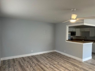 Renovated Waterfront Villa! Freshly painted, vinyl wood flooring on Kings Point Golf -Flanders Way in Florida - for sale on GolfHomes.com, golf home, golf lot