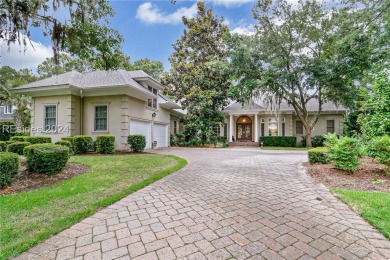 Enjoy the peaceful enlarged screen porch of this classic Belfair on Belfair Golf Club in South Carolina - for sale on GolfHomes.com, golf home, golf lot