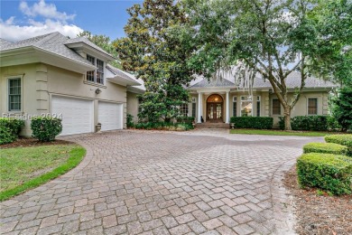 Enjoy the peaceful enlarged screen porch of this classic Belfair on Belfair Golf Club in South Carolina - for sale on GolfHomes.com, golf home, golf lot