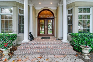 Enjoy the peaceful enlarged screen porch of this classic Belfair on Belfair Golf Club in South Carolina - for sale on GolfHomes.com, golf home, golf lot