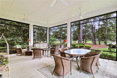 Enjoy the peaceful enlarged screen porch of this classic Belfair on Belfair Golf Club in South Carolina - for sale on GolfHomes.com, golf home, golf lot