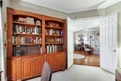 Enjoy the peaceful enlarged screen porch of this classic Belfair on Belfair Golf Club in South Carolina - for sale on GolfHomes.com, golf home, golf lot