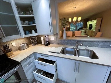 REDUCED to Assist with Improvements. SPECTACULAR EXPANSIVE on Wynmoor Golf Course in Florida - for sale on GolfHomes.com, golf home, golf lot