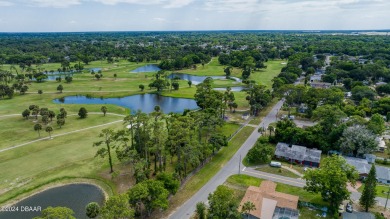 Looking for a cozy home with a convenient location near on Daytona Beach Golf Club in Florida - for sale on GolfHomes.com, golf home, golf lot