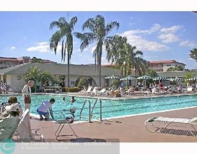 REDUCED to Assist with Improvements. SPECTACULAR EXPANSIVE on Wynmoor Golf Course in Florida - for sale on GolfHomes.com, golf home, golf lot