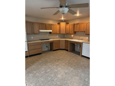 Don't miss this spacious 2,520 sq ft home located on 2.89 acres on The Pines Golf Course at Lake Isabella in Michigan - for sale on GolfHomes.com, golf home, golf lot