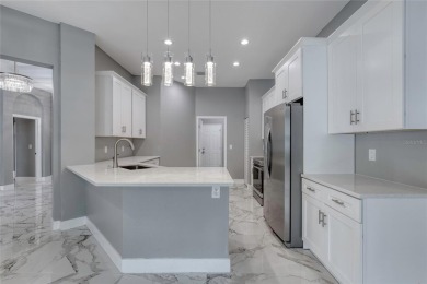This newly remodeled 3-bedroom, 3-bathroom home in the desirable on The Grand Club - Pine Lakes Course in Florida - for sale on GolfHomes.com, golf home, golf lot