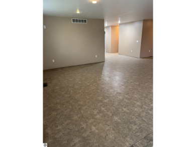 Don't miss this spacious 2,520 sq ft home located on 2.89 acres on The Pines Golf Course at Lake Isabella in Michigan - for sale on GolfHomes.com, golf home, golf lot