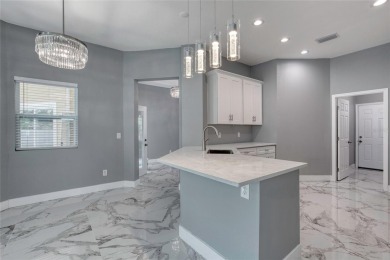 This newly remodeled 3-bedroom, 3-bathroom home in the desirable on The Grand Club - Pine Lakes Course in Florida - for sale on GolfHomes.com, golf home, golf lot