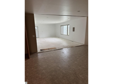 Don't miss this spacious 2,520 sq ft home located on 2.89 acres on The Pines Golf Course at Lake Isabella in Michigan - for sale on GolfHomes.com, golf home, golf lot