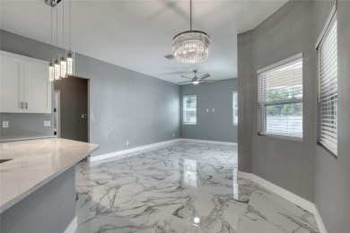 This newly remodeled 3-bedroom, 3-bathroom home in the desirable on The Grand Club - Pine Lakes Course in Florida - for sale on GolfHomes.com, golf home, golf lot