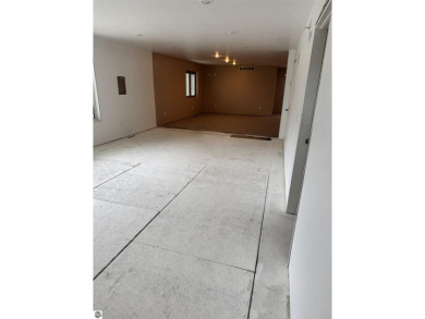 Don't miss this spacious 2,520 sq ft home located on 2.89 acres on The Pines Golf Course at Lake Isabella in Michigan - for sale on GolfHomes.com, golf home, golf lot