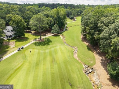 Don't miss this rare opportunity to own a premium lot located on on Great Waters Course At Reynolds Plantation in Georgia - for sale on GolfHomes.com, golf home, golf lot