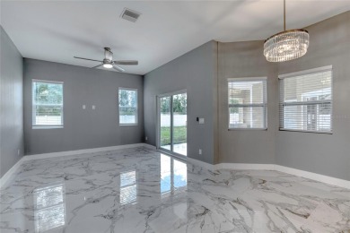 This newly remodeled 3-bedroom, 3-bathroom home in the desirable on The Grand Club - Pine Lakes Course in Florida - for sale on GolfHomes.com, golf home, golf lot