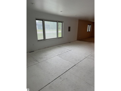 Don't miss this spacious 2,520 sq ft home located on 2.89 acres on The Pines Golf Course at Lake Isabella in Michigan - for sale on GolfHomes.com, golf home, golf lot