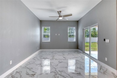 This newly remodeled 3-bedroom, 3-bathroom home in the desirable on The Grand Club - Pine Lakes Course in Florida - for sale on GolfHomes.com, golf home, golf lot