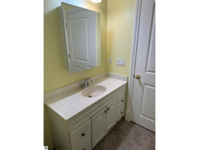 Don't miss this spacious 2,520 sq ft home located on 2.89 acres on The Pines Golf Course at Lake Isabella in Michigan - for sale on GolfHomes.com, golf home, golf lot
