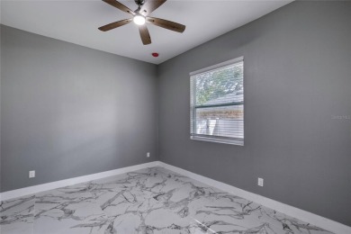 This newly remodeled 3-bedroom, 3-bathroom home in the desirable on The Grand Club - Pine Lakes Course in Florida - for sale on GolfHomes.com, golf home, golf lot
