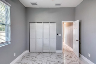 This newly remodeled 3-bedroom, 3-bathroom home in the desirable on The Grand Club - Pine Lakes Course in Florida - for sale on GolfHomes.com, golf home, golf lot