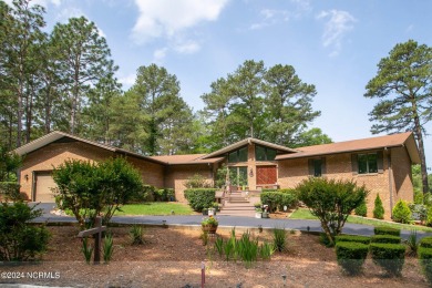 This unique brick home overlooking the 10th green of the award on Seven Lakes Country Club in North Carolina - for sale on GolfHomes.com, golf home, golf lot