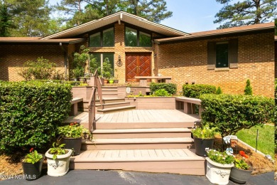 This unique brick home overlooking the 10th green of the award on Seven Lakes Country Club in North Carolina - for sale on GolfHomes.com, golf home, golf lot