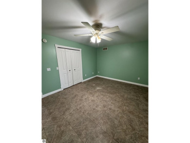 Don't miss this spacious 2,520 sq ft home located on 2.89 acres on The Pines Golf Course at Lake Isabella in Michigan - for sale on GolfHomes.com, golf home, golf lot