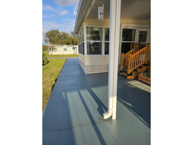 This garage is 32 feet by 22 feet, 2 separate doors, a 12-foot on Southport Springs Golf Club in Florida - for sale on GolfHomes.com, golf home, golf lot