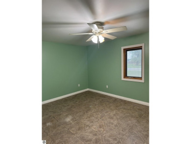 Don't miss this spacious 2,520 sq ft home located on 2.89 acres on The Pines Golf Course at Lake Isabella in Michigan - for sale on GolfHomes.com, golf home, golf lot