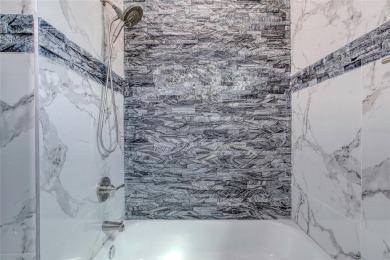 This newly remodeled 3-bedroom, 3-bathroom home in the desirable on The Grand Club - Pine Lakes Course in Florida - for sale on GolfHomes.com, golf home, golf lot