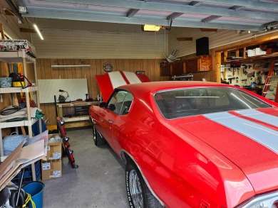 This garage is 32 feet by 22 feet, 2 separate doors, a 12-foot on Southport Springs Golf Club in Florida - for sale on GolfHomes.com, golf home, golf lot