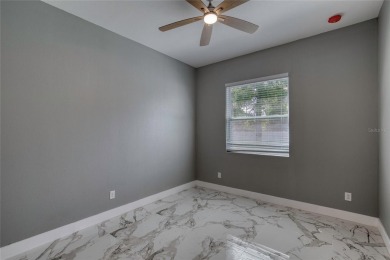 This newly remodeled 3-bedroom, 3-bathroom home in the desirable on The Grand Club - Pine Lakes Course in Florida - for sale on GolfHomes.com, golf home, golf lot