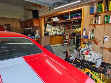 This garage is 32 feet by 22 feet, 2 separate doors, a 12-foot on Southport Springs Golf Club in Florida - for sale on GolfHomes.com, golf home, golf lot