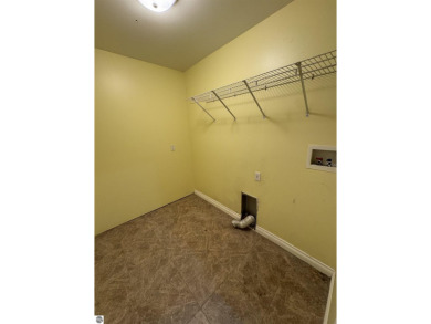 Don't miss this spacious 2,520 sq ft home located on 2.89 acres on The Pines Golf Course at Lake Isabella in Michigan - for sale on GolfHomes.com, golf home, golf lot