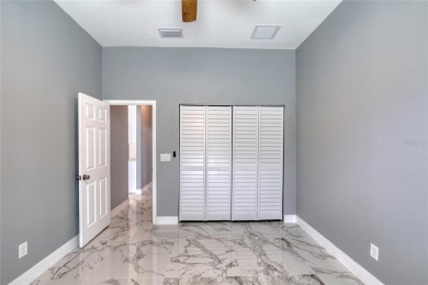 This newly remodeled 3-bedroom, 3-bathroom home in the desirable on The Grand Club - Pine Lakes Course in Florida - for sale on GolfHomes.com, golf home, golf lot