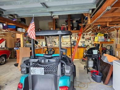 This garage is 32 feet by 22 feet, 2 separate doors, a 12-foot on Southport Springs Golf Club in Florida - for sale on GolfHomes.com, golf home, golf lot