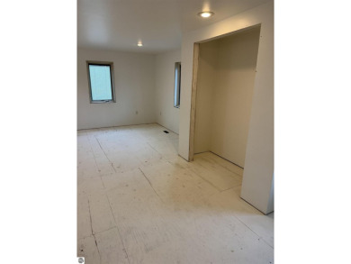 Don't miss this spacious 2,520 sq ft home located on 2.89 acres on The Pines Golf Course at Lake Isabella in Michigan - for sale on GolfHomes.com, golf home, golf lot