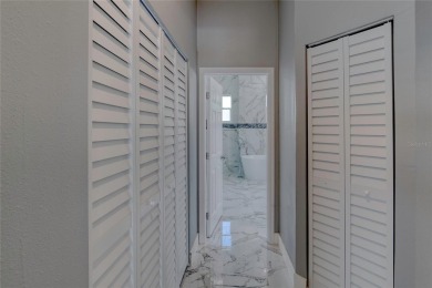 This newly remodeled 3-bedroom, 3-bathroom home in the desirable on The Grand Club - Pine Lakes Course in Florida - for sale on GolfHomes.com, golf home, golf lot