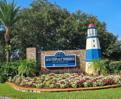 This garage is 32 feet by 22 feet, 2 separate doors, a 12-foot on Southport Springs Golf Club in Florida - for sale on GolfHomes.com, golf home, golf lot