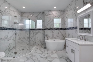 This newly remodeled 3-bedroom, 3-bathroom home in the desirable on The Grand Club - Pine Lakes Course in Florida - for sale on GolfHomes.com, golf home, golf lot