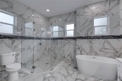 This newly remodeled 3-bedroom, 3-bathroom home in the desirable on The Grand Club - Pine Lakes Course in Florida - for sale on GolfHomes.com, golf home, golf lot