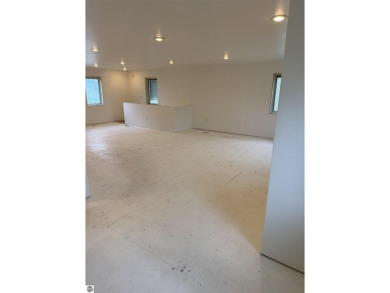 Don't miss this spacious 2,520 sq ft home located on 2.89 acres on The Pines Golf Course at Lake Isabella in Michigan - for sale on GolfHomes.com, golf home, golf lot